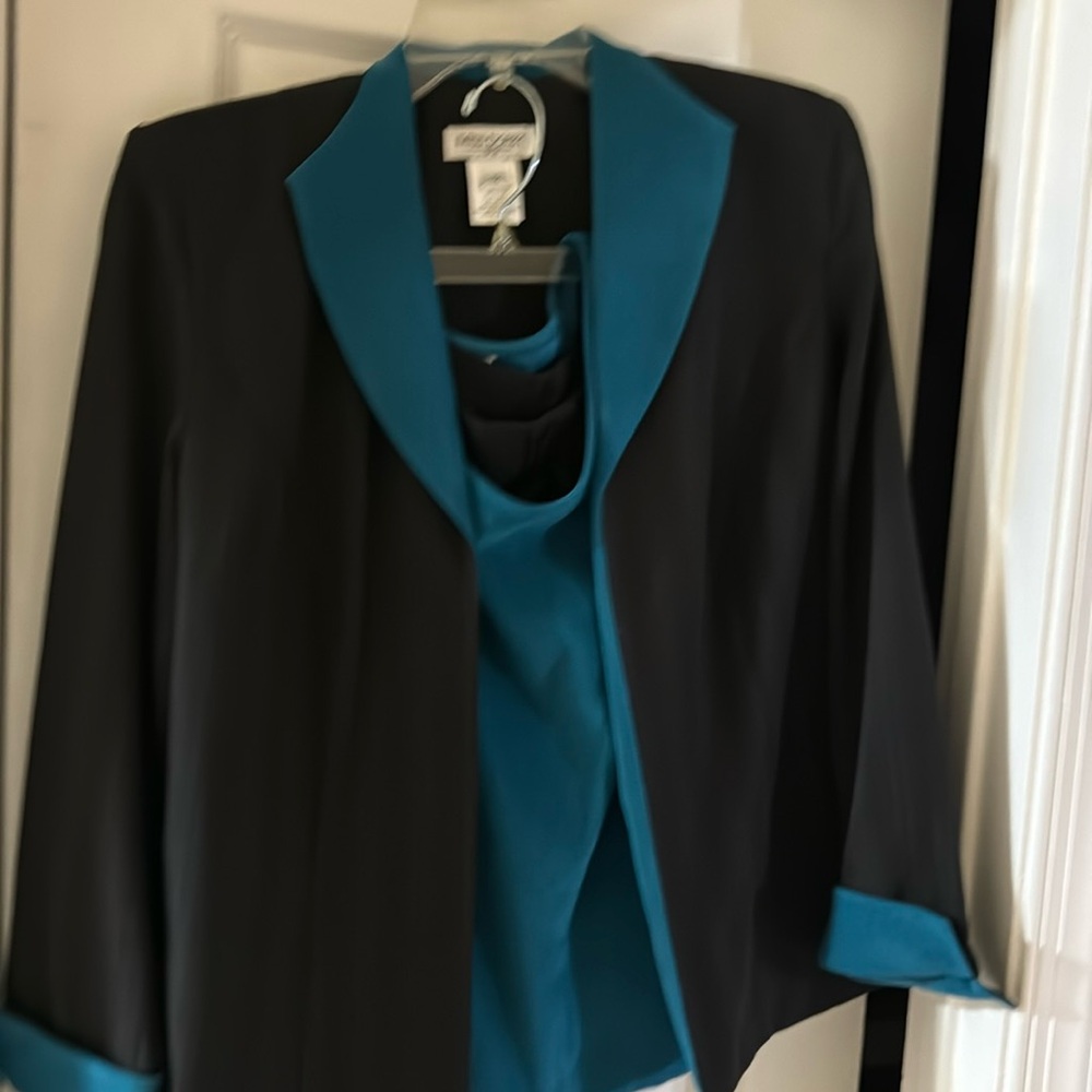 3 Piece suit size 12 but fits size 10. Shirt under jacket is very soft like new